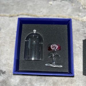 Swarovski clutch brand new never used and Swarovski crystal rose.